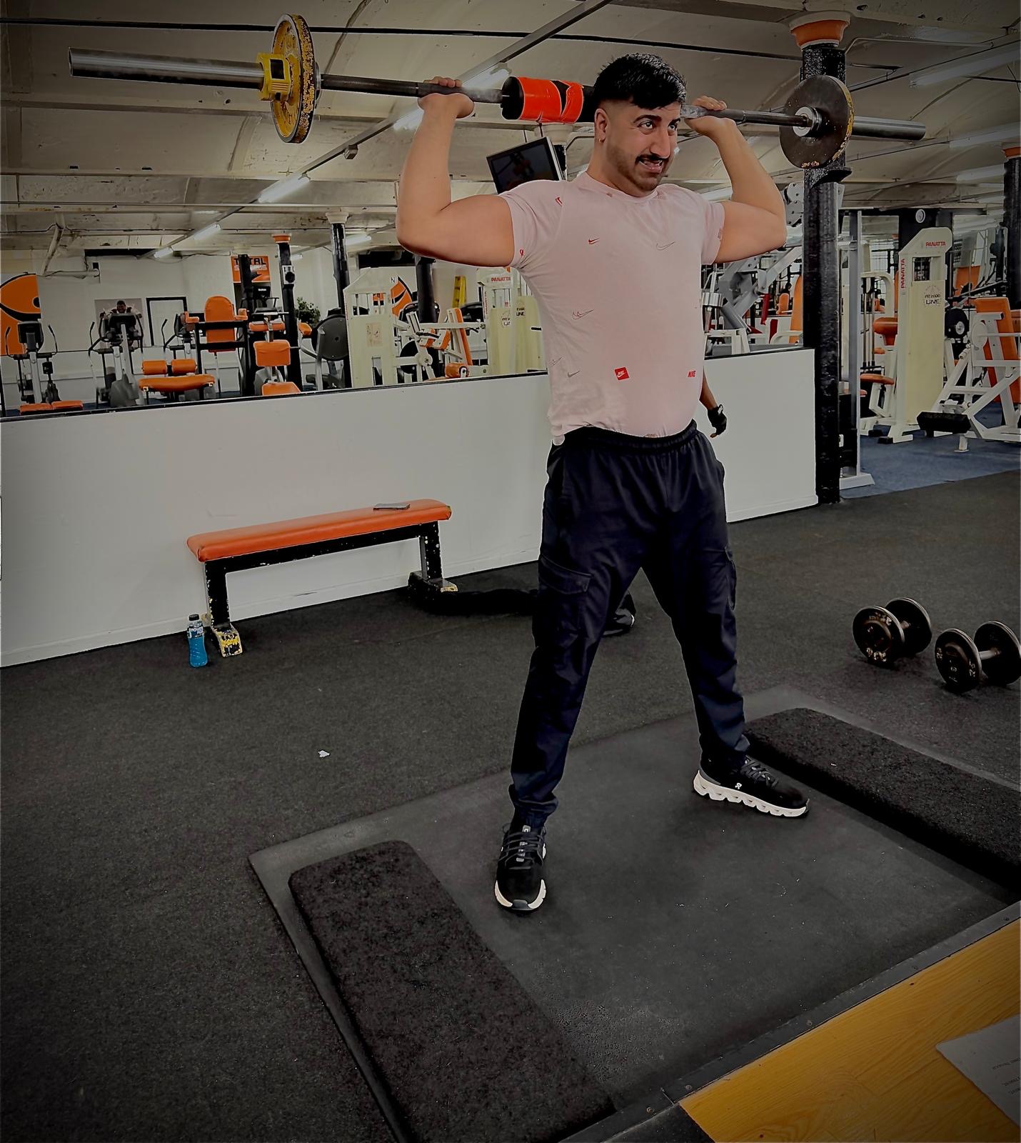 Member performing a barbell squat