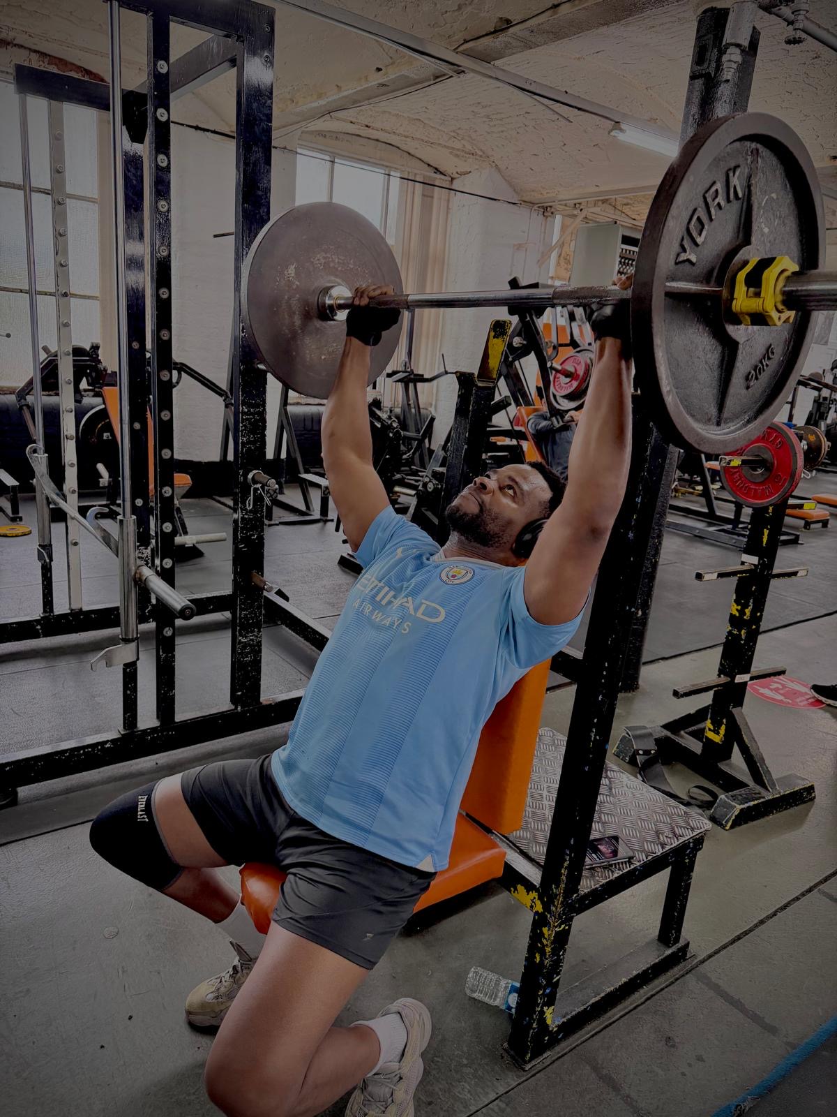 Member training on the incline bench press
