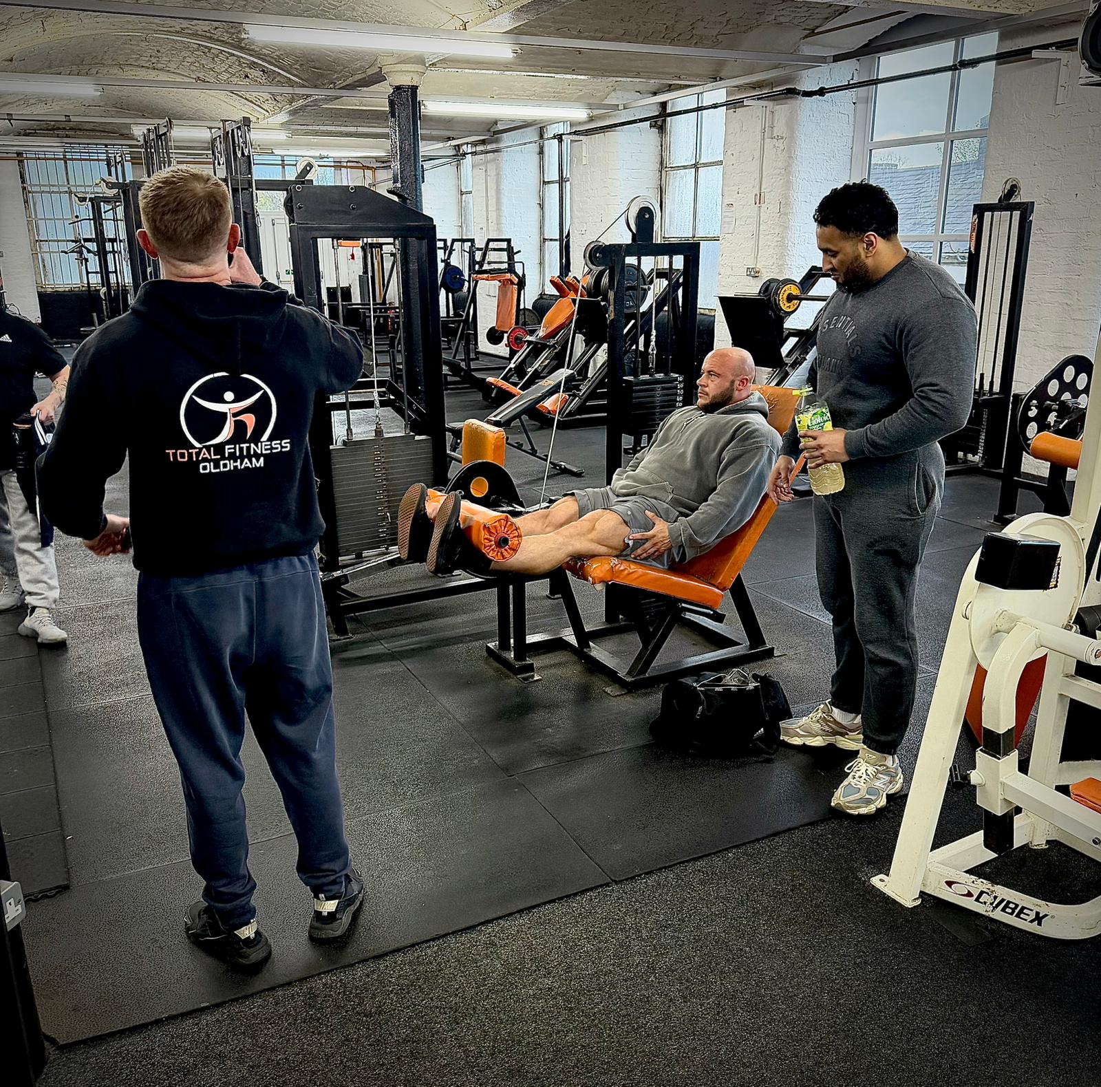 Friends supporting each other during a workout