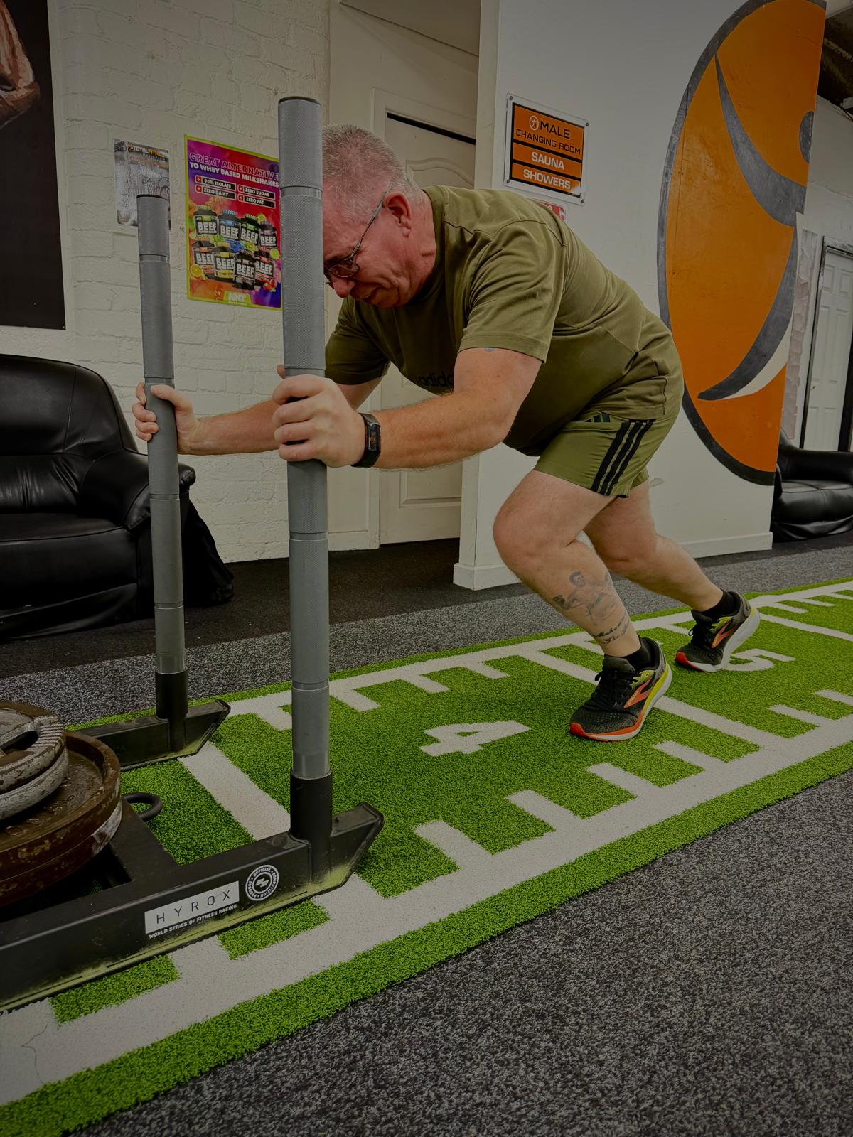 Member pushing the Hyrox sled